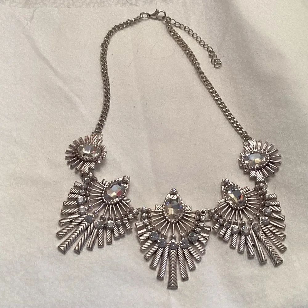 Adjustable Bedazeling Choker Silvertone and clear crystals.